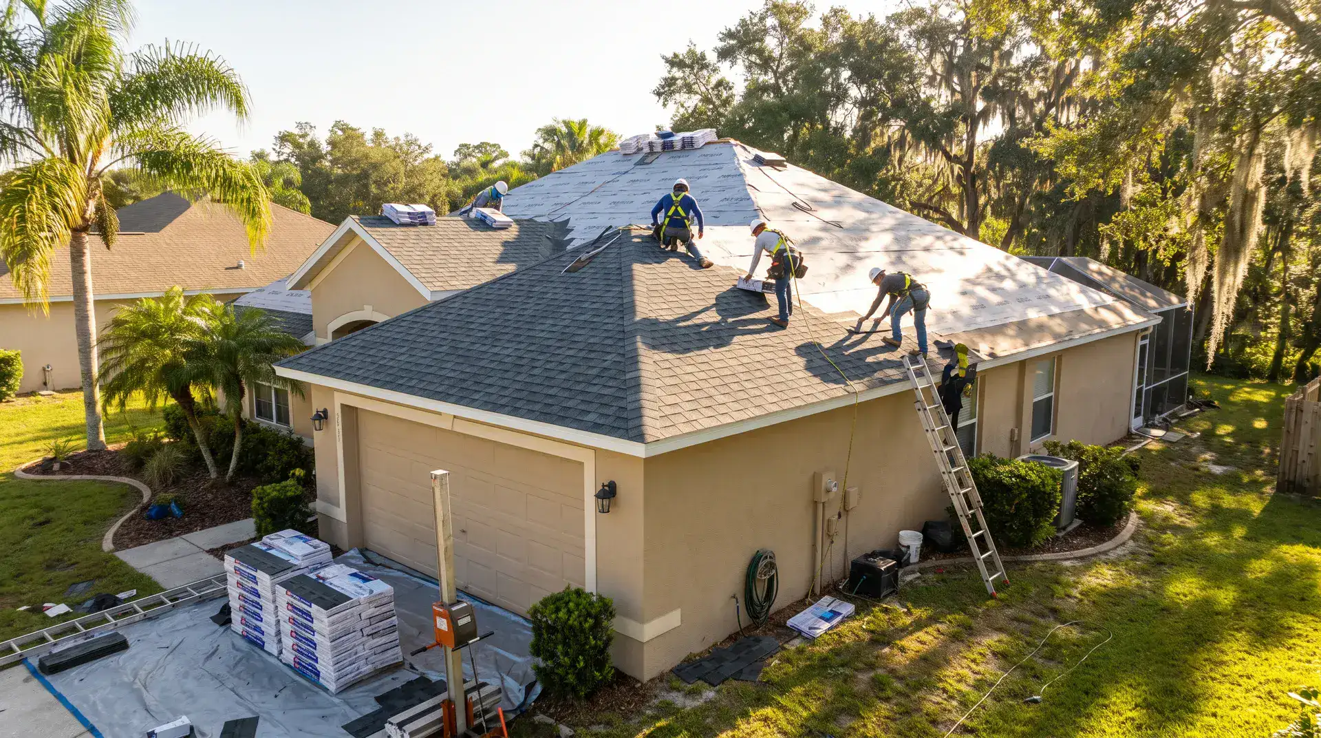 Roofing crew completing a full replacement on a Central Florida home